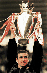 Cantona with the Premier League trophy. 